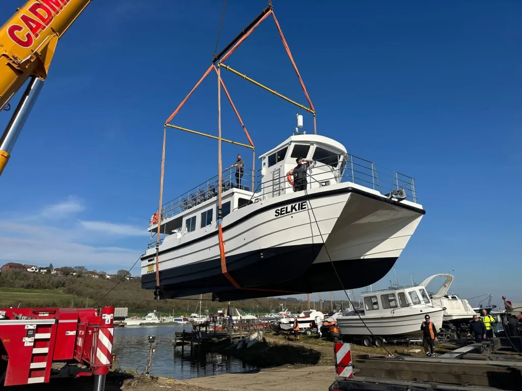 Charter passenger boat Selkie being lifted at the boatyard